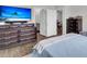 Bright bedroom with dark wood furniture, comfortable bed, and view to the hallway at 244 Wild Strawberry Ln, Moncks Corner, SC 29461