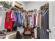 Walk-in closet featuring wire shelving, hanging clothes, shoes, and storage boxes at 244 Wild Strawberry Ln, Moncks Corner, SC 29461