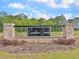 Community entrance sign featuring brick columns, landscaping and the community name 'Carolina Groves' at 244 Wild Strawberry Ln, Moncks Corner, SC 29461