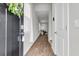 Inviting hallway with wood flooring leads to a bright living area, enhancing the home's appeal at 244 Wild Strawberry Ln, Moncks Corner, SC 29461