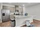 Spacious kitchen featuring a large island with granite countertops and stainless steel appliances at 244 Wild Strawberry Ln, Moncks Corner, SC 29461