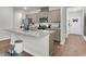 Spacious kitchen with a granite island and stainless steel appliances, perfect for cooking at 244 Wild Strawberry Ln, Moncks Corner, SC 29461