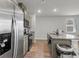 Modern kitchen with stainless steel appliances, granite countertops and center island with sink at 244 Wild Strawberry Ln, Moncks Corner, SC 29461