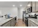 Modern kitchen featuring stainless steel appliances, granite countertops, and ample cabinet space at 244 Wild Strawberry Ln, Moncks Corner, SC 29461