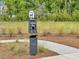 A community pet waste station for clean up after your dog is placed on the side of the community walking path at 244 Wild Strawberry Ln, Moncks Corner, SC 29461