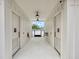 An access hallway to the community pool restrooms with a drinking fountain and fire extinguisher at 244 Wild Strawberry Ln, Moncks Corner, SC 29461