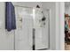 Bathroom shower featuring a sliding glass door and built-in shelving for toiletries at 244 Wild Strawberry Ln, Moncks Corner, SC 29461