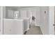 Upstairs hallway with multiple doors leading to bedrooms and storage areas at 244 Wild Strawberry Ln, Moncks Corner, SC 29461