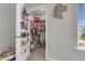 Well-organized walk-in closet with shelving and storage, suitable for a room at 244 Wild Strawberry Ln, Moncks Corner, SC 29461
