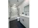 Contemporary bathroom featuring marble wall tile, a shower and tub combination, and modern vanity with vessel sink at 2508 Corona St, North Charleston, SC 29405
