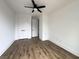 This bedroom boasts hardwood floors, white trim, and a closet with white doors and black hardware at 2508 Corona St, North Charleston, SC 29405