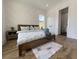 Bright bedroom with a wooden frame bed, light blue accents, and a stylish accent wall design at 2508 Corona St, North Charleston, SC 29405