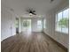 Spacious bedroom with a ceiling fan, wood floors, and sliding glass doors that lead to a balcony at 2508 Corona St, North Charleston, SC 29405