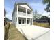 Charming two-story home with a double porch, modern gray siding, and spacious concrete driveway at 2508 Corona St, North Charleston, SC 29405