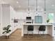 Modern kitchen with white cabinets, quartz countertops, stainless steel appliances, and island seating at 2508 Corona St, North Charleston, SC 29405