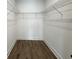 Uncluttered walk-in closet featuring wall-to-wall wire shelving and wood-look flooring at 2508 Corona St, North Charleston, SC 29405