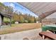 Expansive backyard includes a hot tub, outdoor seating, and string lights, ideal for entertaining or unwinding at 255 S Railroad Ave, Ridgeville, SC 29472
