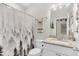 Bathroom featuring decorative shower curtain, granite countertop, and modern sink at 255 S Railroad Ave, Ridgeville, SC 29472