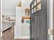 Warm entryway featuring hardwood floors, coat rack, and a glimpse of the open-concept living space at 255 S Railroad Ave, Ridgeville, SC 29472