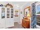 Welcoming entryway with hardwood floors, a wooden dresser, and a bright window at 255 S Railroad Ave, Ridgeville, SC 29472