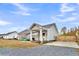 Charming exterior showcases a quaint back porch, complemented by a well-maintained yard, and fenced parking at 255 S Railroad Ave, Ridgeville, SC 29472