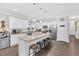 Bright kitchen featuring an island with seating and stainless steel appliances at 255 S Railroad Ave, Ridgeville, SC 29472