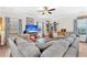 Cozy living area with a large sectional sofa, fireplace, and a mounted television at 255 S Railroad Ave, Ridgeville, SC 29472