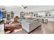 Spacious living room with hardwood floors, a comfortable sectional sofa, and an open layout at 255 S Railroad Ave, Ridgeville, SC 29472