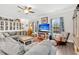 Bright living room with custom built-in shelving, cozy seating, and natural light at 255 S Railroad Ave, Ridgeville, SC 29472