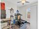 Functional home workout room with treadmill, exercise bike, and natural light at 255 S Railroad Ave, Ridgeville, SC 29472