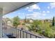 Relaxing balcony view of the neighborhood, featuring lush greenery, parking areas, and the vibrant urban scenery at 259 E Bay St # 7C, Charleston, SC 29401