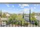 Balcony view showcasing green surroundings and cityscape views with a cloudy sky above, and black metal fencing around at 259 E Bay St # 7C, Charleston, SC 29401