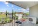Enjoy the views from this balcony overlooking parking and the community's lush surroundings, with a glimpse of city skyline at 259 E Bay St # 7C, Charleston, SC 29401