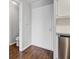 Neutral-toned hallway featuring access to a bathroom with toilet, along with a stainless steel dishwasher at 259 E Bay St # 7C, Charleston, SC 29401