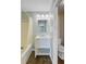 Bright bathroom featuring a white vanity, modern fixtures, and a shower with a curtain for a clean, updated look at 259 E Bay St # 7C, Charleston, SC 29401