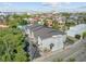 An aerial view shows the apartment building with gray siding and black roof at 259 E Bay St # 7C, Charleston, SC 29401