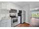 Bright kitchen with white cabinetry and stainless steel appliances at 259 E Bay St # 7C, Charleston, SC 29401