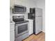 Kitchen features stainless steel appliances and white cabinetry at 259 E Bay St # 7C, Charleston, SC 29401