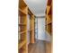 The walk-in closet offers an array of wooden shelves and drawers to maximize storage and organize clothing and accessories at 259 E Bay St # 7C, Charleston, SC 29401