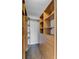 Organized walk-in closet with wooden shelves, drawers, and hanging rods for optimal storage, and stylish hardwood flooring at 259 E Bay St # 7C, Charleston, SC 29401