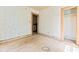 Unfinished room with hardwood floors, two door openings, needs renovation at 2654 Harvey Ave, North Charleston, SC 29405