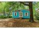 Charming blue home with white trim, shuttered windows, and a tree-lined front yard at 2654 Harvey Ave, North Charleston, SC 29405