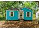 Charming blue house featuring white trim, shuttered windows and a quaint front porch at 2654 Harvey Ave, North Charleston, SC 29405