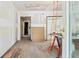 Bright room featuring hardwood floors, white walls ready for paint, and natural light at 2654 Harvey Ave, North Charleston, SC 29405