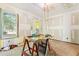 Bright living room featuring refinished hardwood floors, large windows, and a backyard view at 2654 Harvey Ave, North Charleston, SC 29405