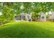 Well-manicured backyard with a screened porch and mature trees providing ample shade and privacy at 3025 Buckeley Cir, Charleston, SC 29414