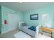 Cozy green bedroom featuring a twin bed, closet, and desk, perfect for a or guest at 3025 Buckeley Cir, Charleston, SC 29414