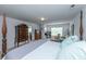 Large bedroom featuring a four-poster bed, a relaxing sitting area, and ample natural light at 3025 Buckeley Cir, Charleston, SC 29414