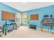 Blue bedroom with a cork board, toys, gaming setup, and a window for natural lighting at 3025 Buckeley Cir, Charleston, SC 29414