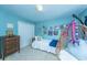 Serene blue bedroom with hanging chair, playful decor, and comfortable bed with hanging chair at 3025 Buckeley Cir, Charleston, SC 29414